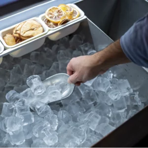 hand with scoop in commercial ice maker (featured image)