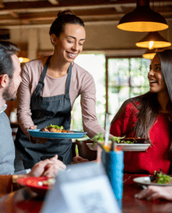 Waiter serving food - Proactive Allergen Prevention in the Foodservice Industry