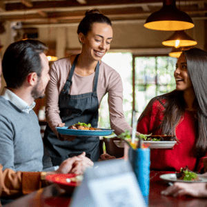 Waiter serving food - Proactive Allergen Prevention in the Foodservice Industry (featured)