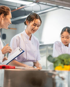 three foodservice workers training - Breaking the cycle of food safety failures from 2024